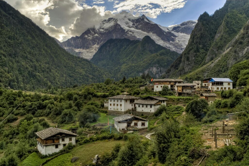 pexels-photo-1531660-1531660 Picturesque village nestled in the Himalayas with lush greenery and towering mountains.