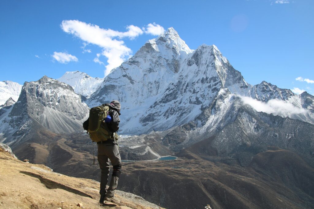 pexels-photo-15917025-15917025 Backpacker exploring the stunning snow-capped mountains in Dingboche, Nepal.